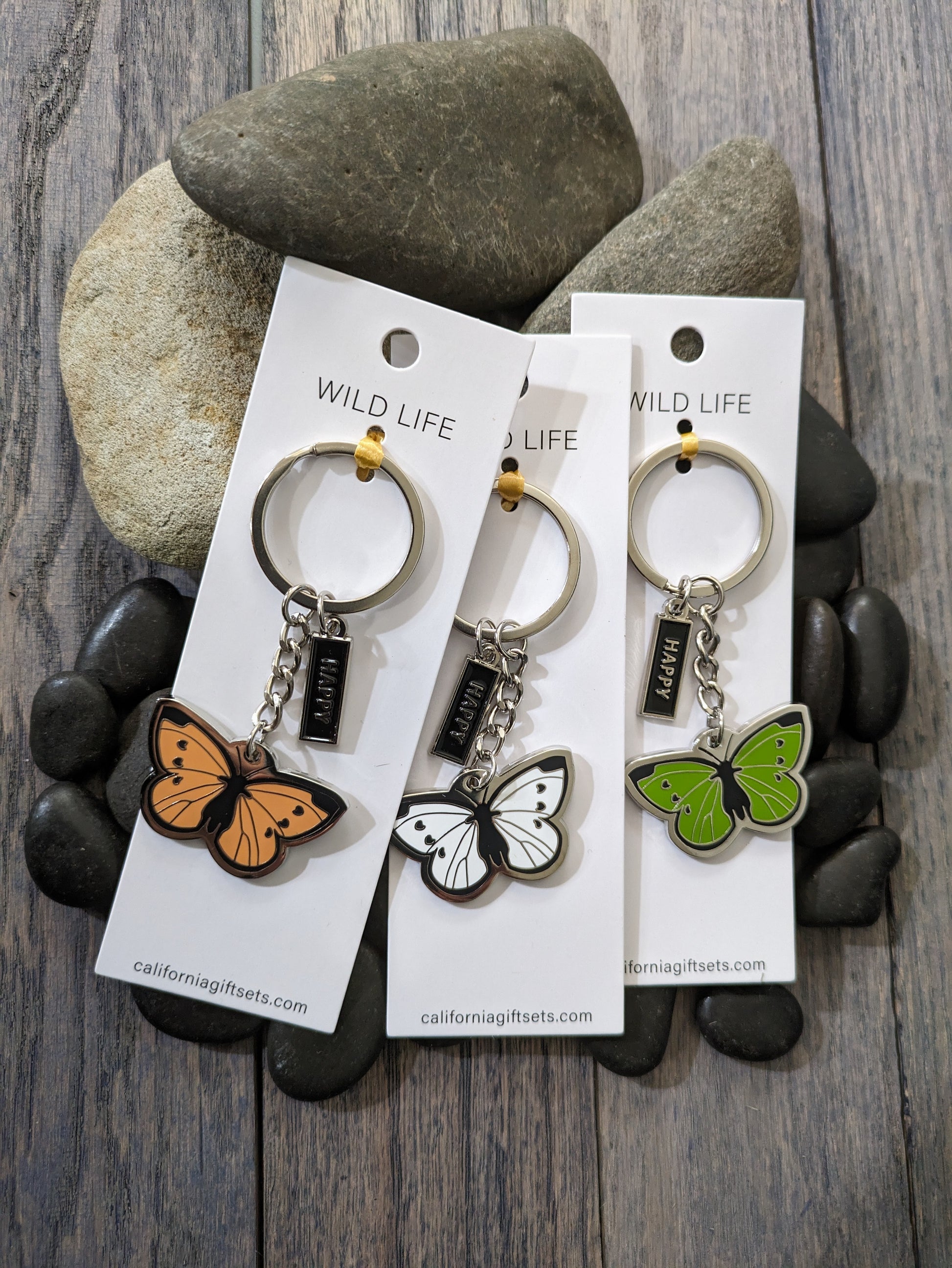 Quality Crafted Elegant -Silver Enamel Butterfly Key chains in 3 Beautiful colors of Tangerine , White, and Mild Lime Green. Each Key chain comes with an additional enamel hanging Tag with the word HAPPY.
Each Key chain is mounted on sturdy 1.75" x 5" Pure White Card for a beautiful display.
