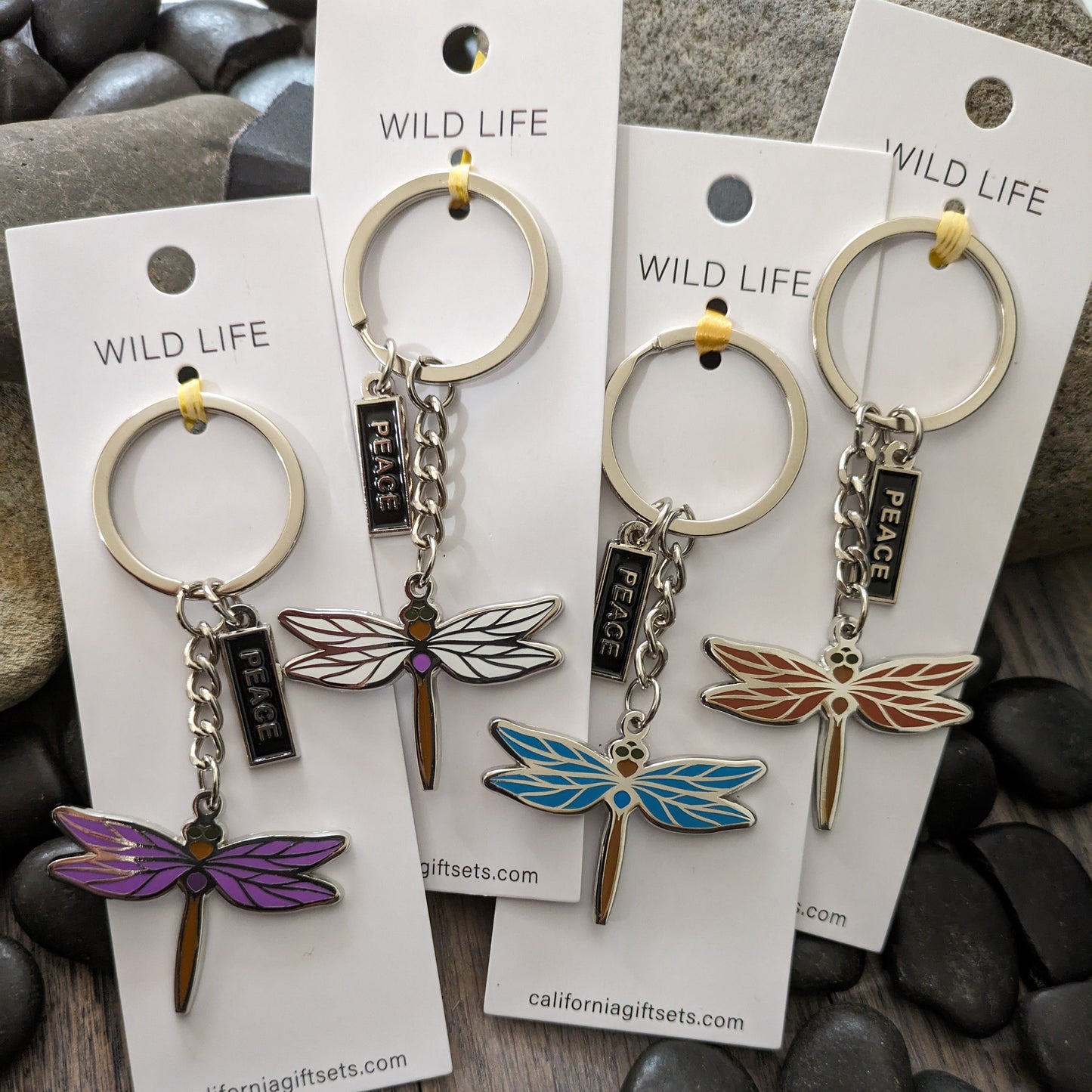 Quality Crafted Elegant -Silver Enamel Dragonfly Keychains in 3-4 Beautiful colors of Purple , White, Blue. Each Key chain comes with an additional enamel hanging Tag with the word PEACE.
Each Key chain is mounted on sturdy 1.75" x 5" Pure White Card for a beautiful display.
