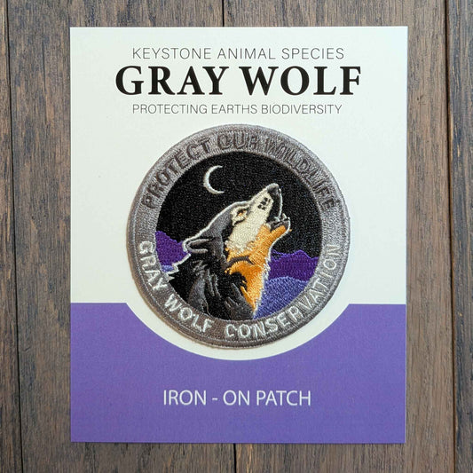 Wolf conservation -Embroidered Howling Wolf Iron- On Patch. Quality eco threads rich deep  purple mountains, vibrant Grey and Black fur colors threads. 2.5" diameter perfect for  fabric , hats, back packs.